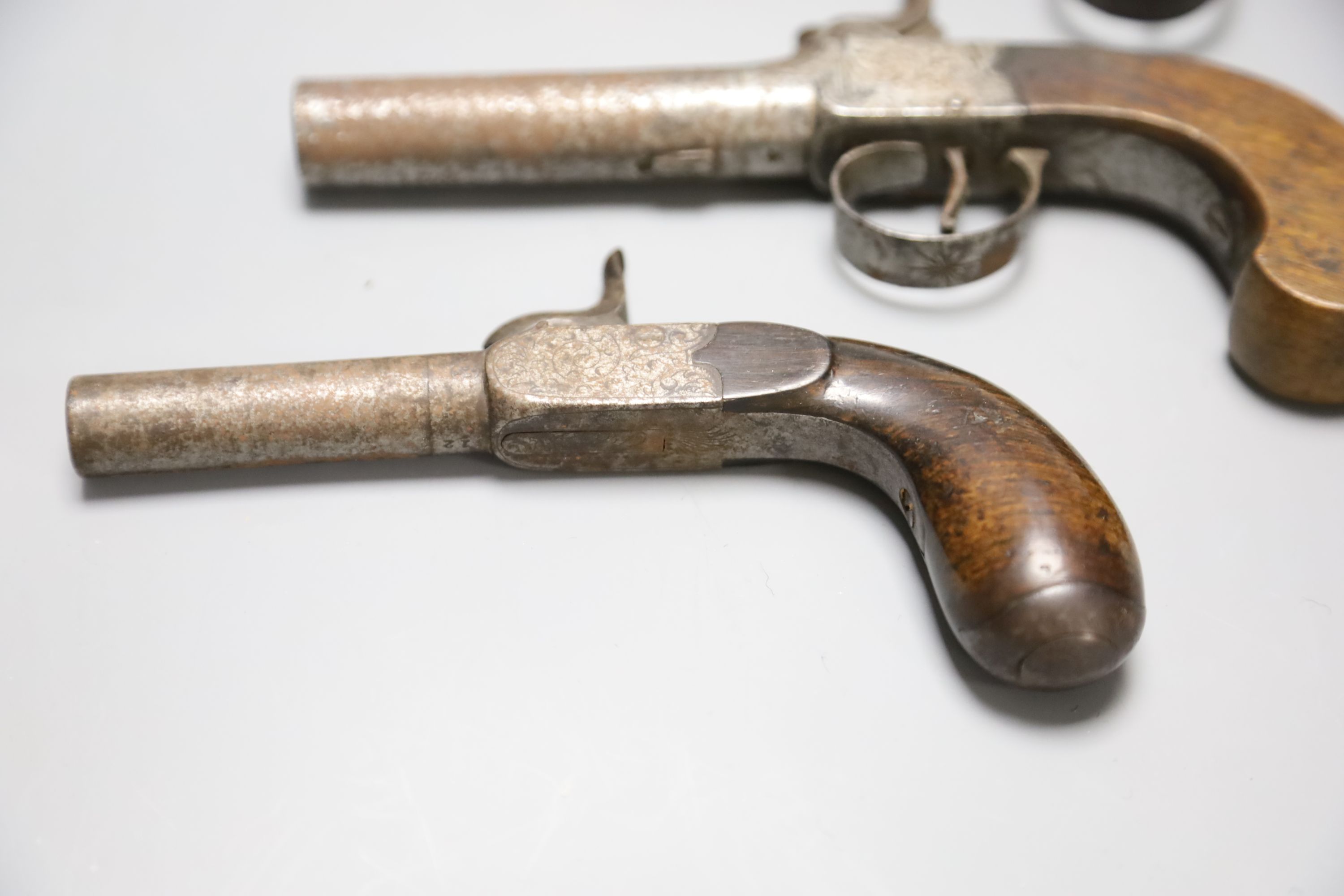 A Wilson of London box lock percussion cap pistol and two others